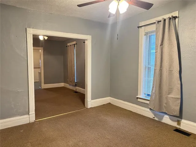 wooden floor and window in an empty room