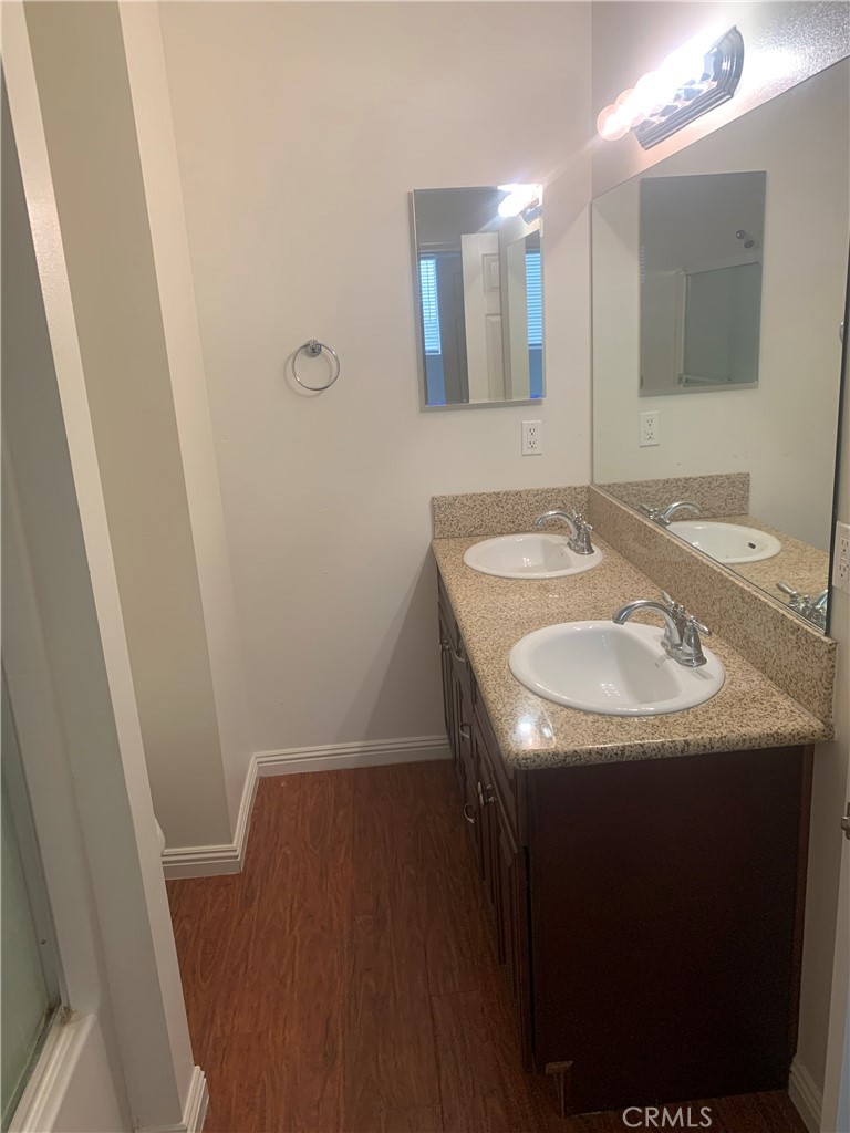 920 Central Avenue, Unit 101 Riverside, CA 92507 - Photo 17 of 23 a bathroom with a sink and a mirror
