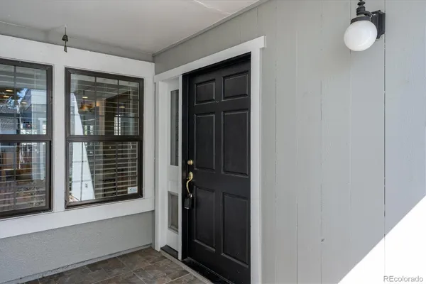 a view of a door and a window