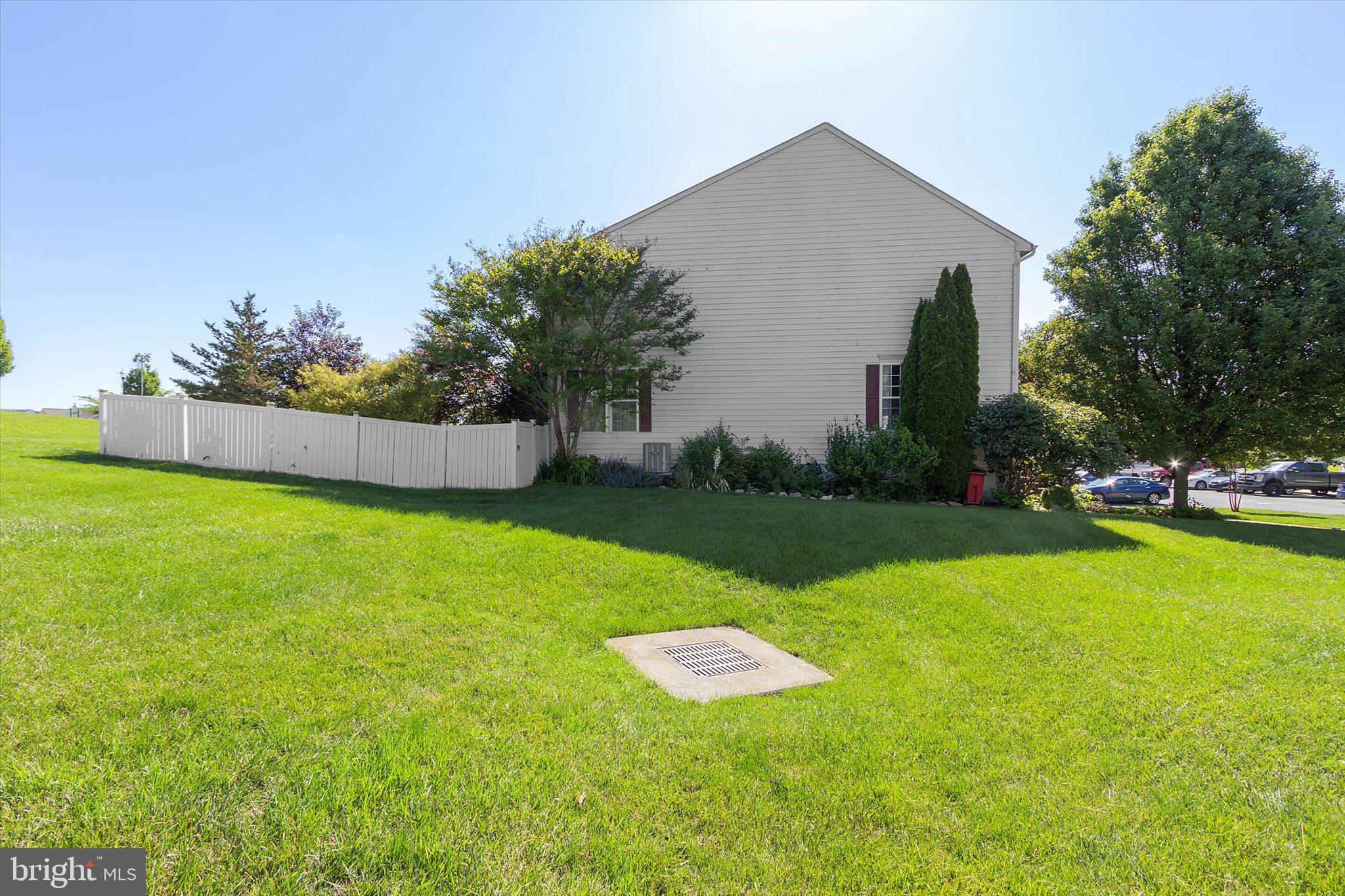 171 Riparian Lane Ranson, WV 25438 - Photo 11 of 53 End Unit: HOA mows grass outside fence.