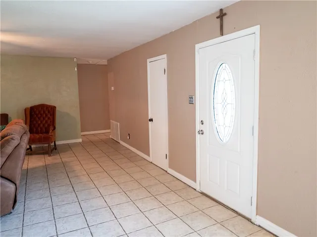 a view of a livingroom with furniture and a window
