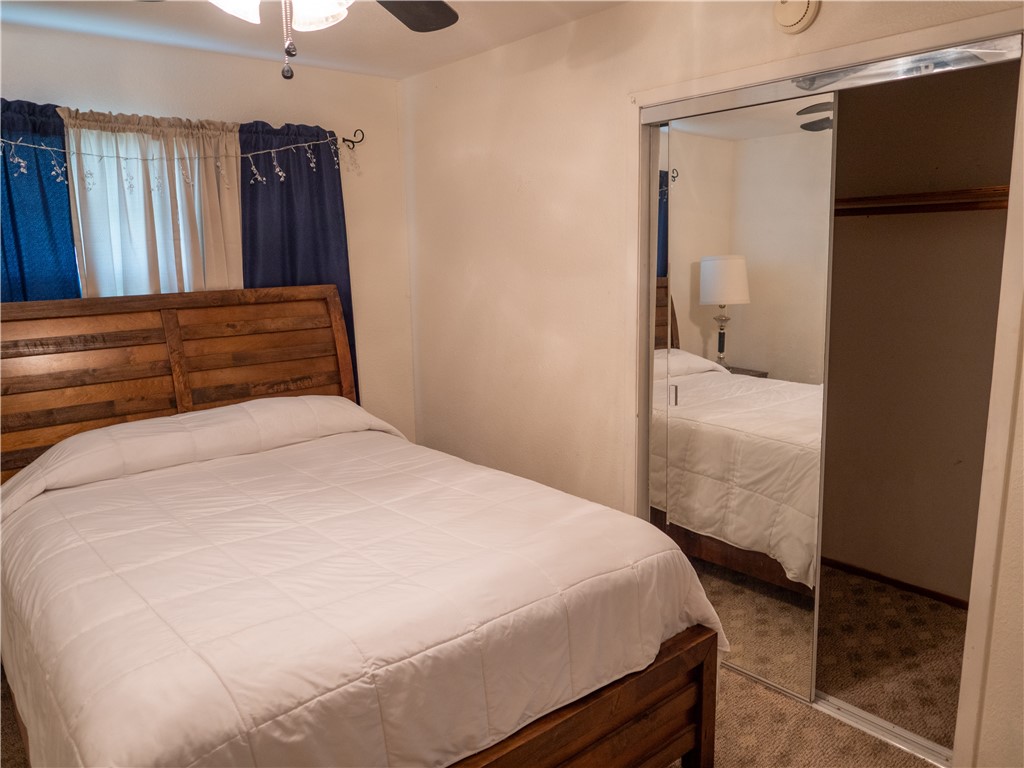 372 East Fm 771 Riviera, TX 78379 - Photo 34 of 40 a bedroom with a bed and wooden floor