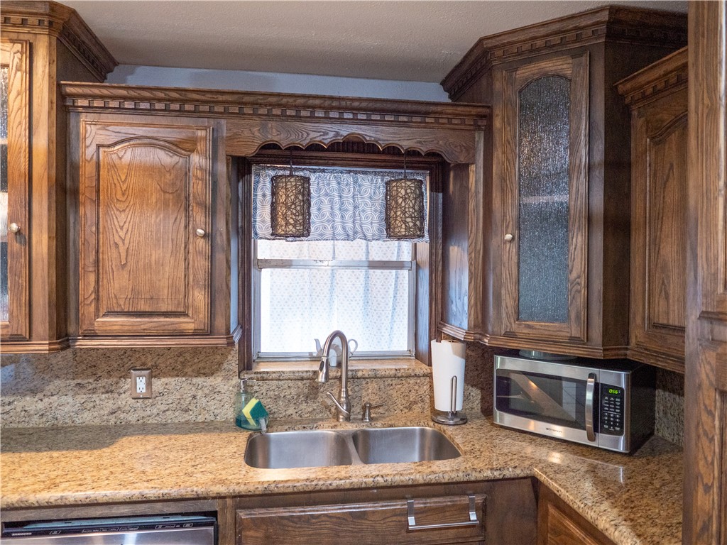 372 East Fm 771 Riviera, TX 78379 - Photo 9 of 40 a bathroom with a granite countertop sink and a mirror