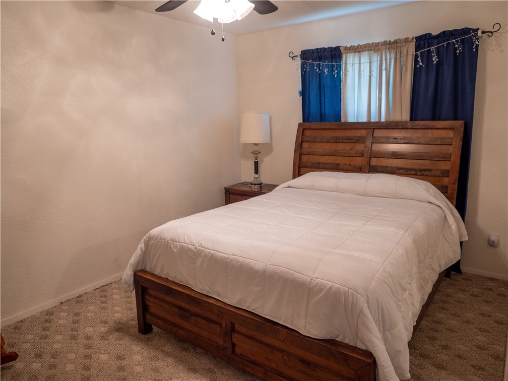 372 East Fm 771 Riviera, TX 78379 - Photo 10 of 40 a bed sitting in a bedroom and wooden floor