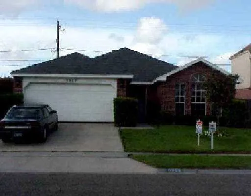 a car parked in front of a house