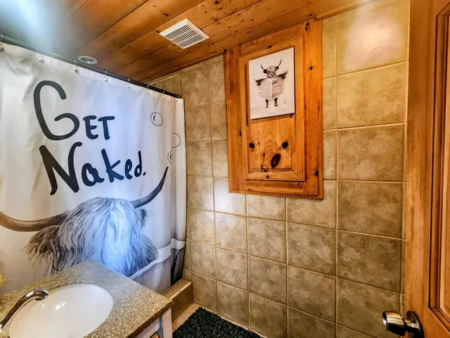 an empty room with a door and a window