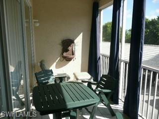 519 Roma Court, Unit 207 Naples, FL 34110 - Photo 7 of 8 a view of balcony and patio