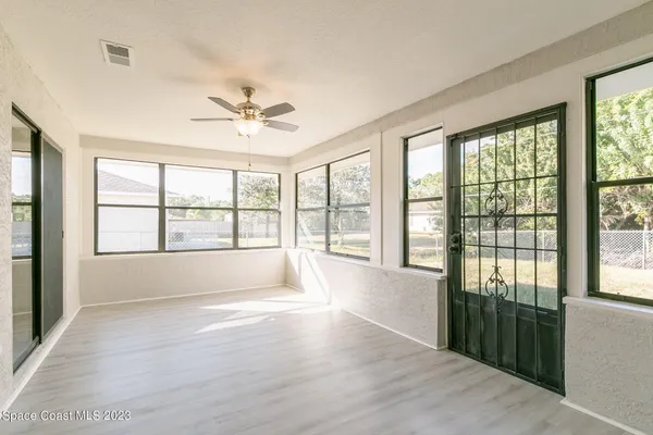 a view of an empty room with a window