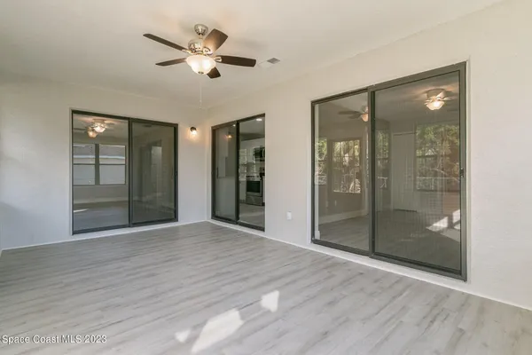 a view of an empty room with a bathroom