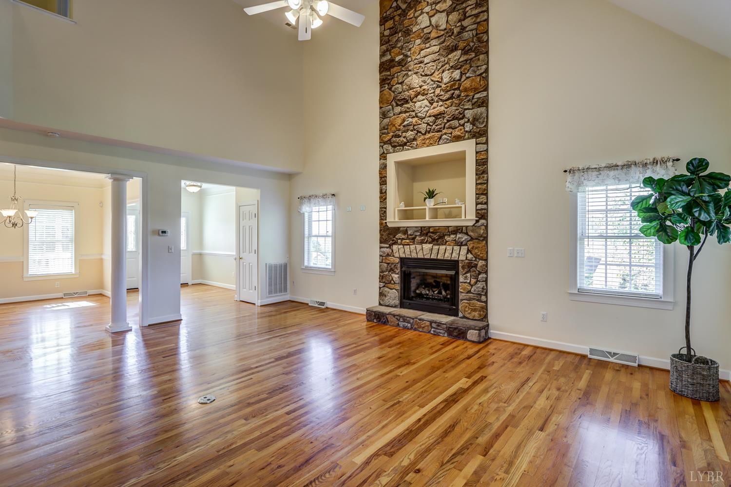 1315 Donnally Road Forest, VA 24551 - Photo 12 of 74 an empty room with windows and a fireplace