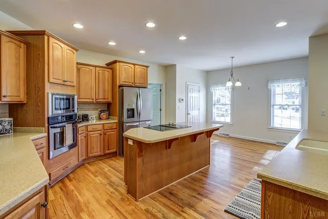 a kitchen with a stove and cabinets
