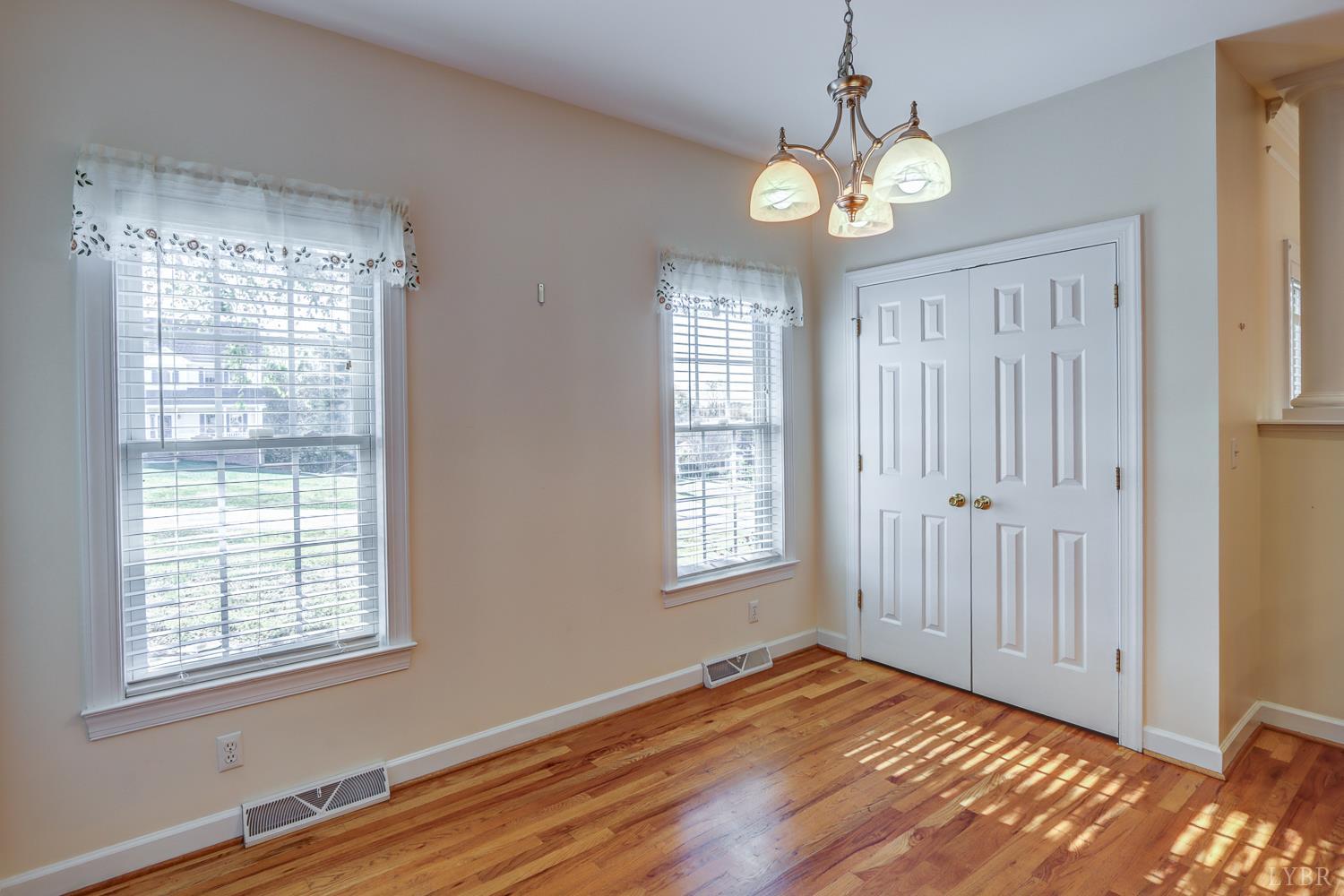 1315 Donnally Road Forest, VA 24551 - Photo 21 of 74 an empty room with wooden floor and windows