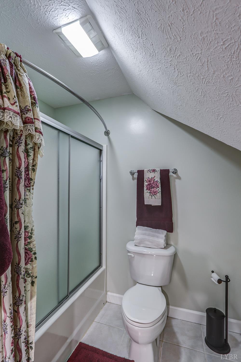 1315 Donnally Road Forest, VA 24551 - Photo 46 of 74 a bathroom with a toilet and a shower