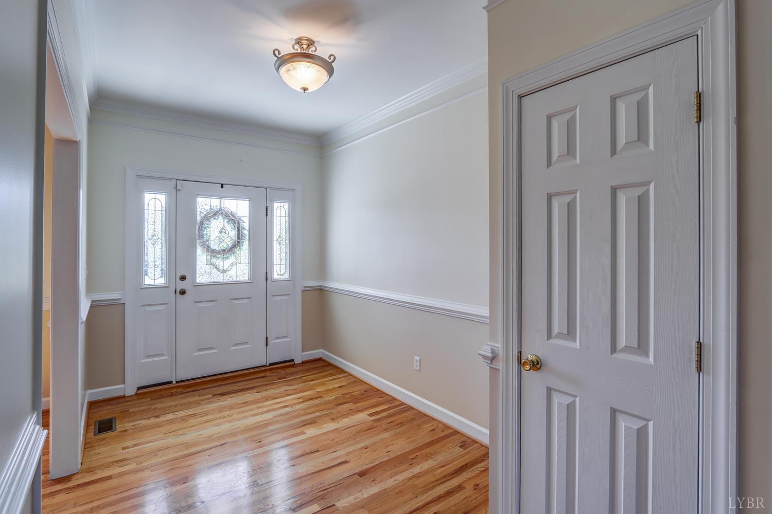1315 Donnally Road Forest, VA 24551 - Photo 5 of 74 a view of a room with wooden floor and white walls