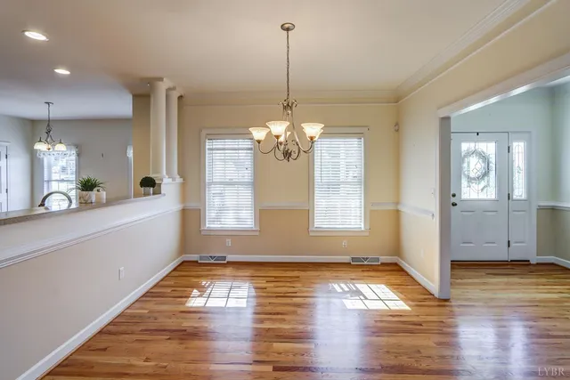 a view of a living room with wooden floor