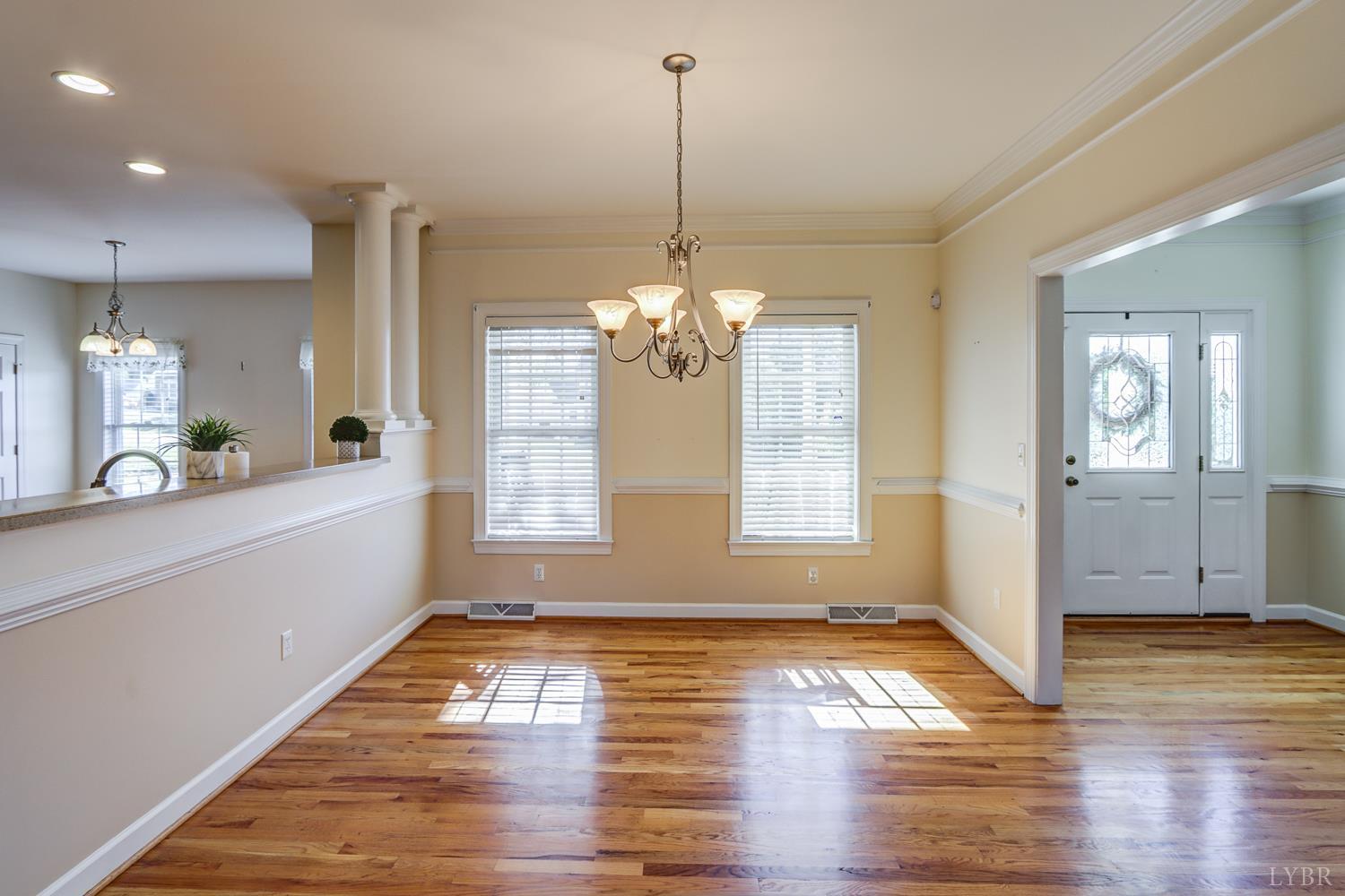1315 Donnally Road Forest, VA 24551 - Photo 7 of 74 a view of a kitchen with wooden floor and a chandelier