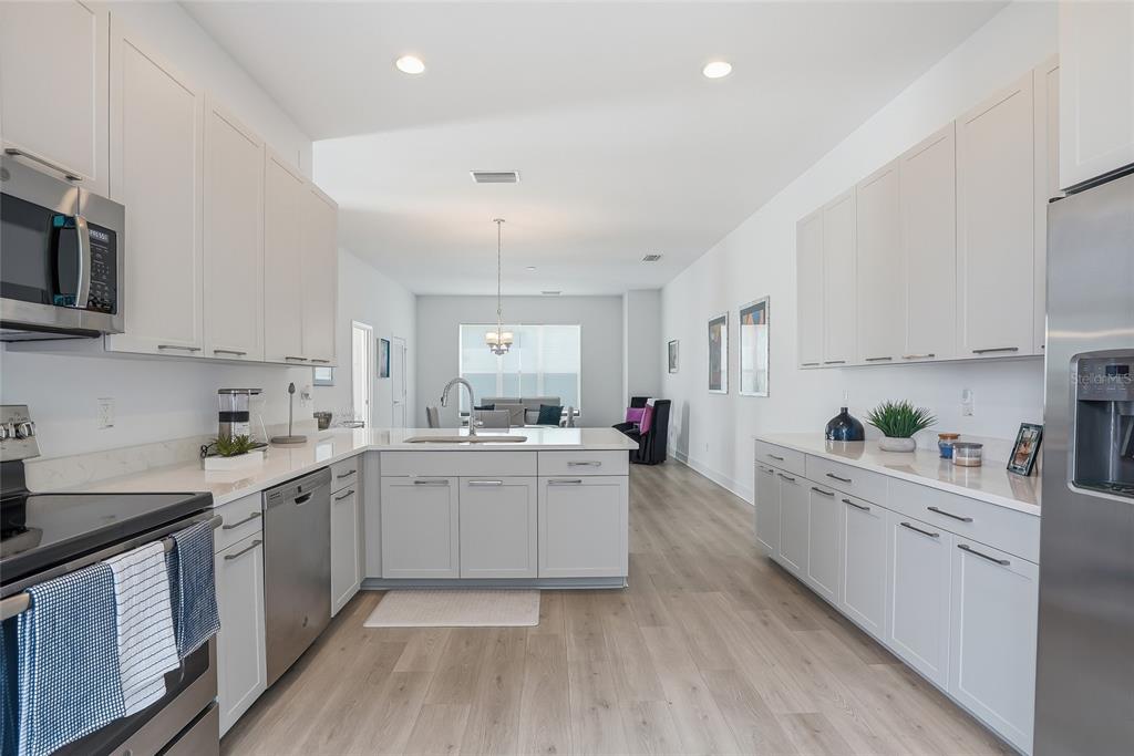 4810 West McElroy Avenue, Unit 30 Tampa, FL 33611 - Photo 18 of 43 a kitchen with a white cabinets and window