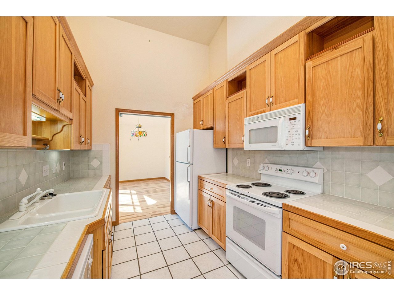 683 Cedar Ridge Circle Estes Park, CO 80517 - Photo 16 of 39 a kitchen with stainless steel appliances a stove a sink and a microwave