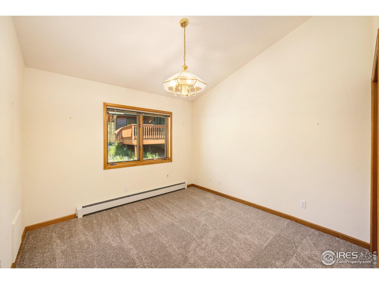 683 Cedar Ridge Circle Estes Park, CO 80517 - Photo 22 of 39 a view of an empty room with a window