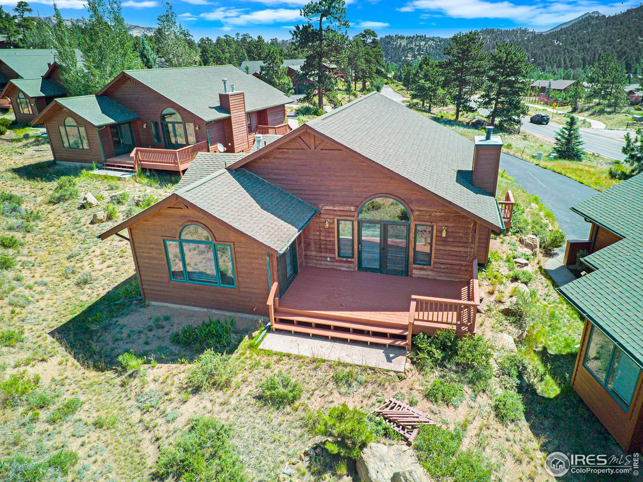 683 Cedar Ridge Circle Estes Park, CO 80517 - Photo 26 of 39 an aerial view of a house with a yard
