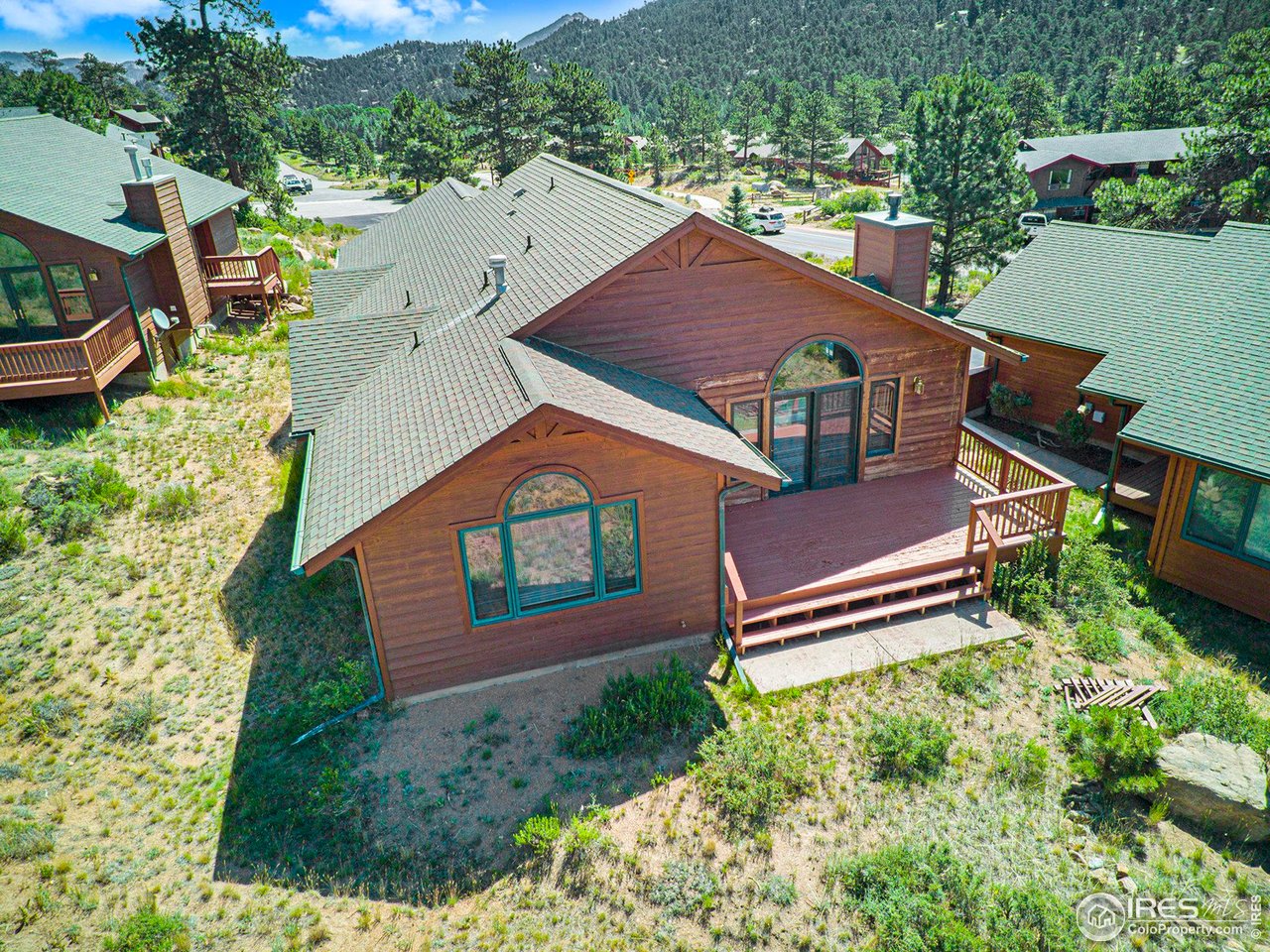 683 Cedar Ridge Circle Estes Park, CO 80517 - Photo 27 of 39 an aerial view of a house with a yard