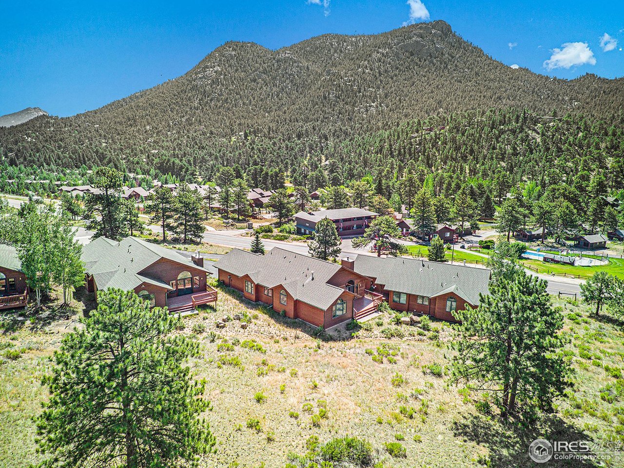 683 Cedar Ridge Circle Estes Park, CO 80517 - Photo 35 of 39 a aerial view of a house with a yard and mountain view in back