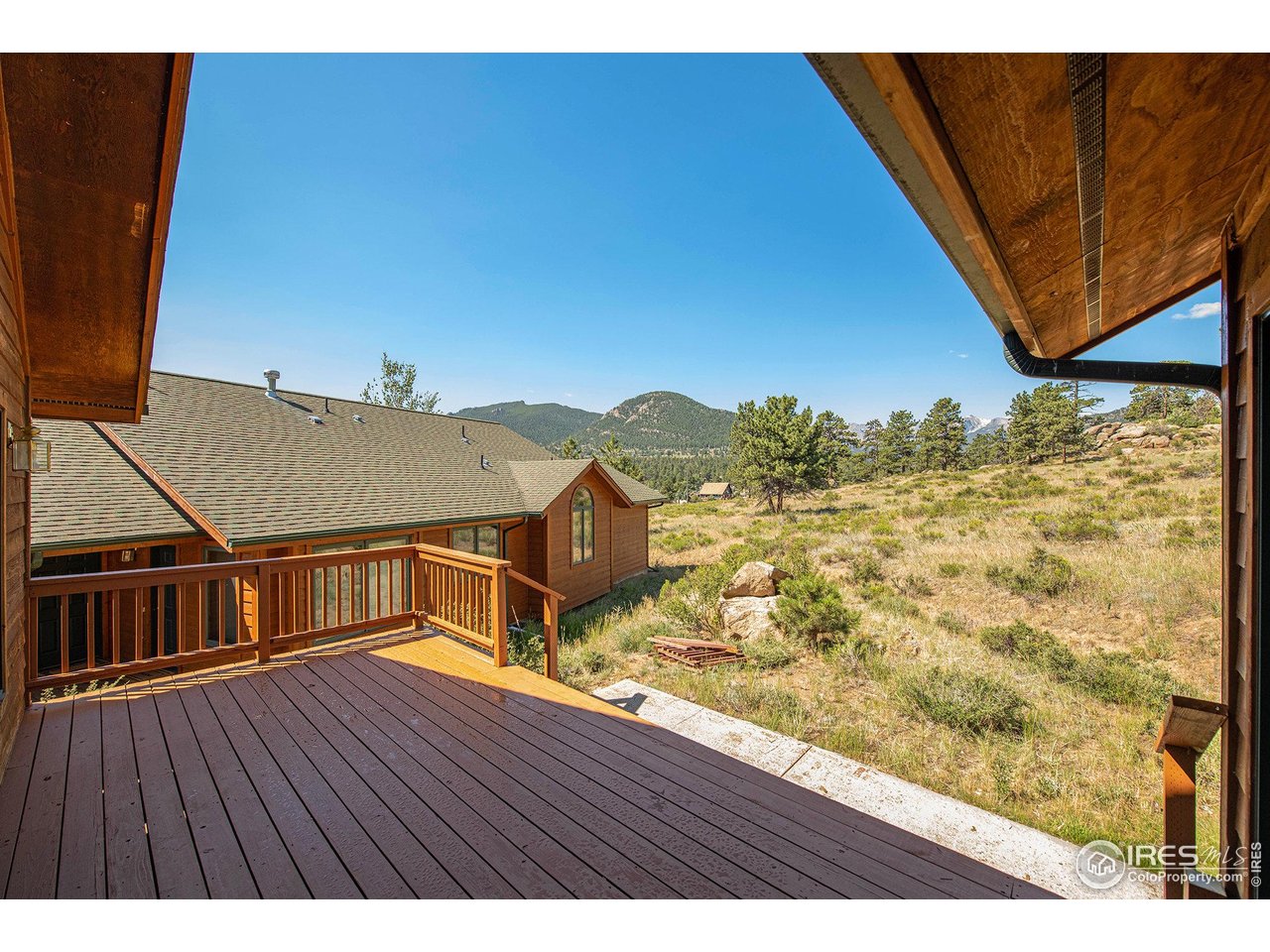683 Cedar Ridge Circle Estes Park, CO 80517 - Photo 7 of 39 a view of a balcony with wooden floor and city view