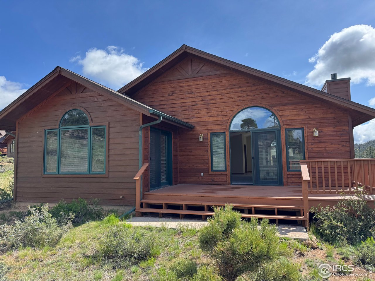 683 Cedar Ridge Circle Estes Park, CO 80517 - Photo 8 of 39 a front view of a house with a yard