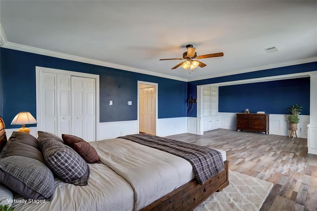 7359 Highway 154 Sulphur Springs, TX 75482 - Photo 24 of 40 upstairs primary is huge, with separate library/seating area, crown molding, wainscoting, two closets