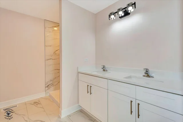 a bathroom with a sink and mirror