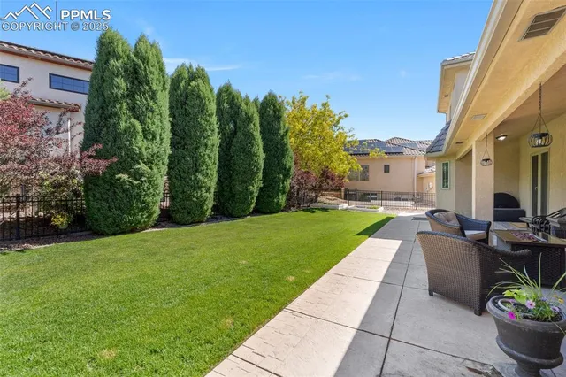 a view of a patio with couches and potted plants