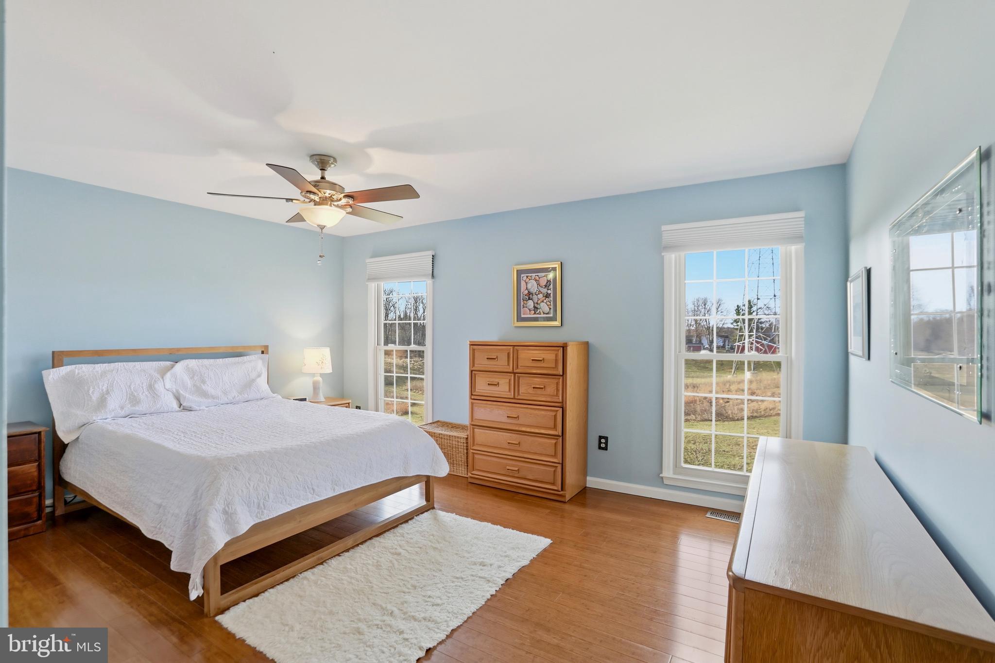 4708 Summit Point Road Charles Town, WV 25414 - Photo 15 of 49 a bedroom with a large bed and a window