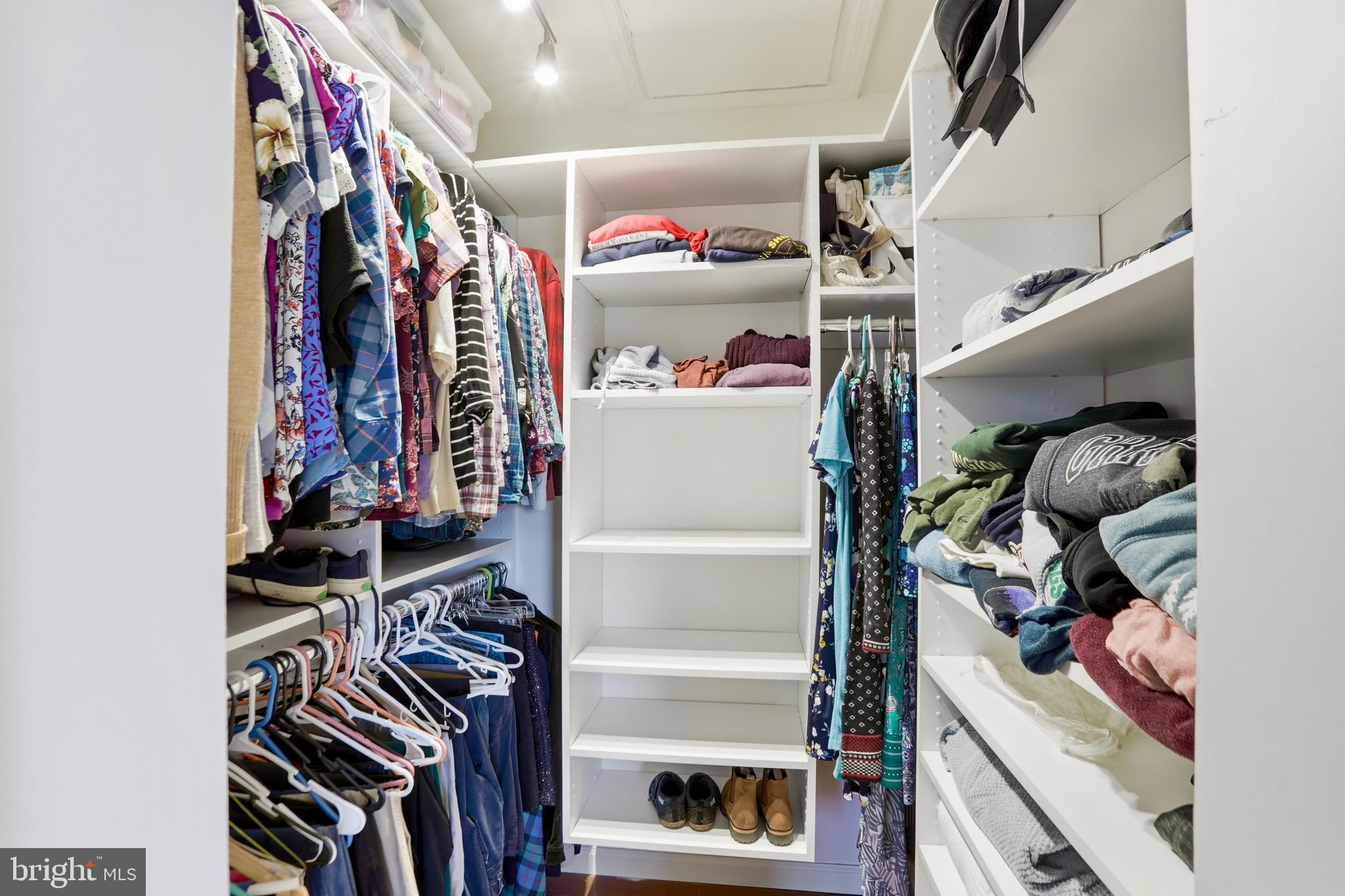 4708 Summit Point Road Charles Town, WV 25414 - Photo 19 of 49 a view of walk in closet with clothes and shoes