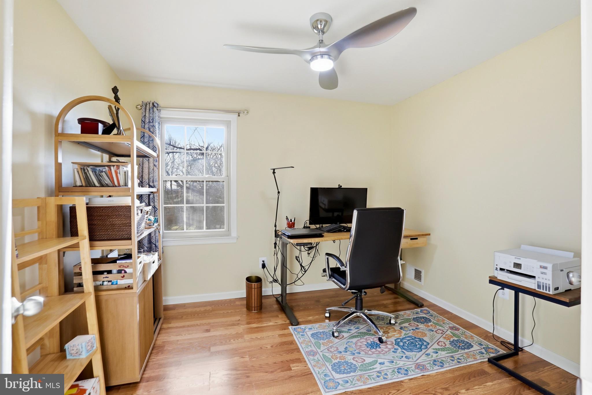 4708 Summit Point Road Charles Town, WV 25414 - Photo 20 of 49 a view of a workspace with furniture and a window