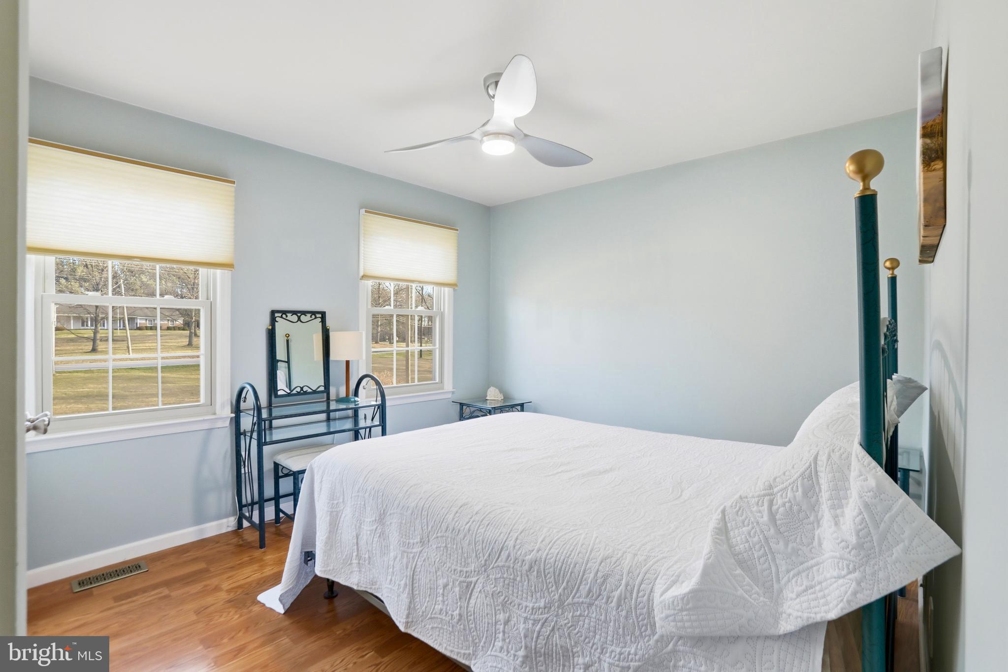 4708 Summit Point Road Charles Town, WV 25414 - Photo 21 of 49 a bedroom with a bed and a large window