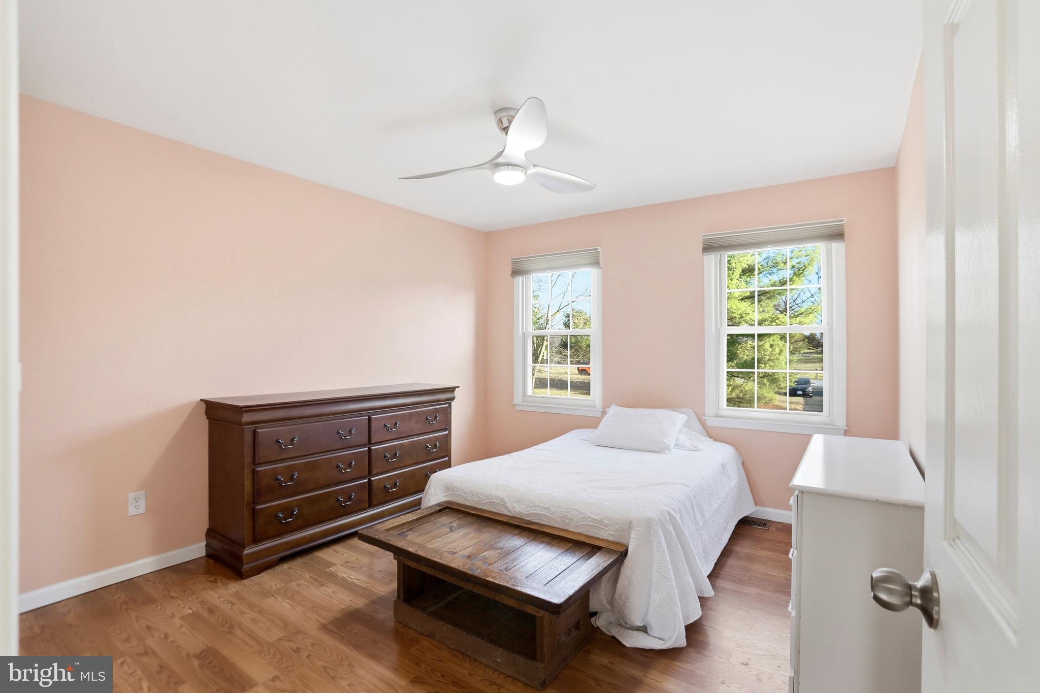 4708 Summit Point Road Charles Town, WV 25414 - Photo 22 of 49 a bedroom with a bed and window