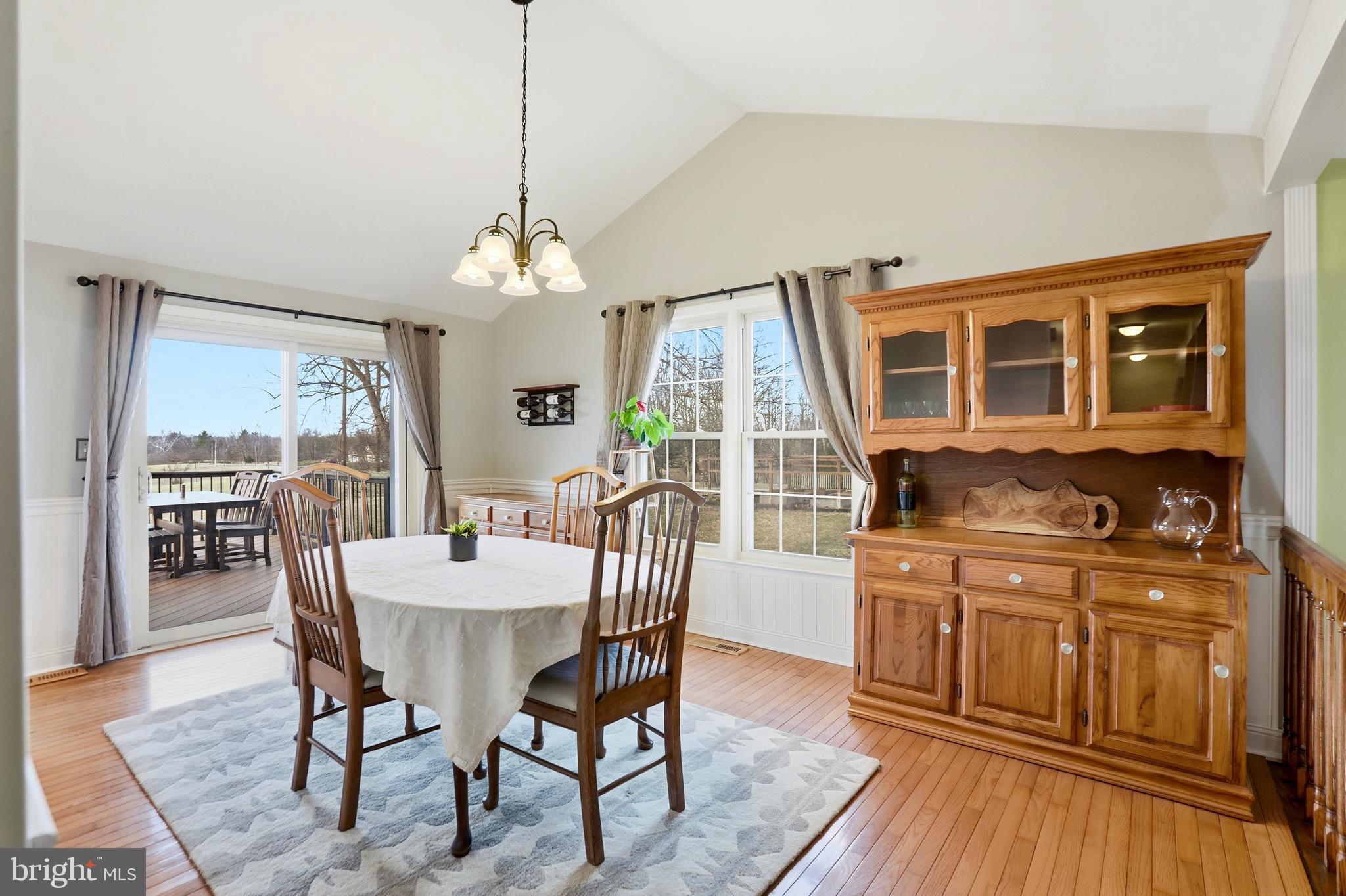 4708 Summit Point Road Charles Town, WV 25414 - Photo 6 of 49 a dining room with furniture window wooden floor
