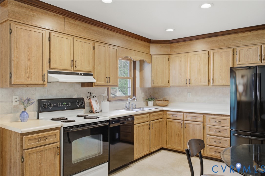 9832 Alfaree Road Richmond, VA 23237 - Photo 13 of 35 Kitchen with black appliances, light countertops,