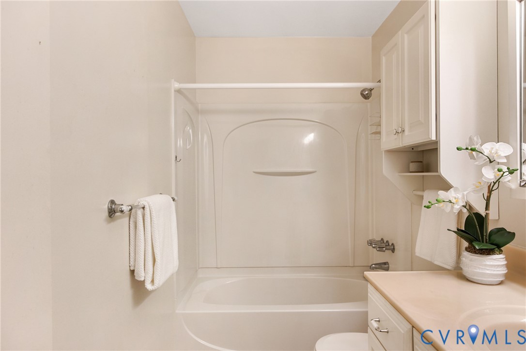 9832 Alfaree Road Richmond, VA 23237 - Photo 24 of 35 a bathroom with a shower curtain and a sink