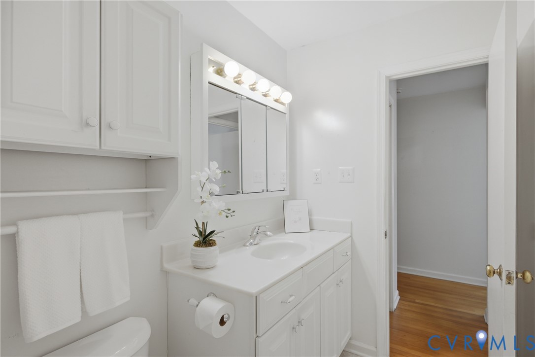 9832 Alfaree Road Richmond, VA 23237 - Photo 25 of 35 Bathroom featuring vanity and light wood-style flo