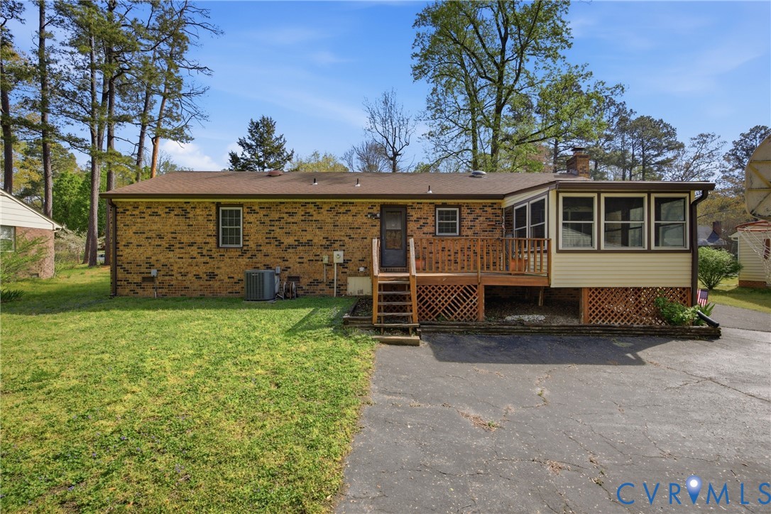 9832 Alfaree Road Richmond, VA 23237 - Photo 29 of 35 Rear view of house with a sunroom, brick siding, a