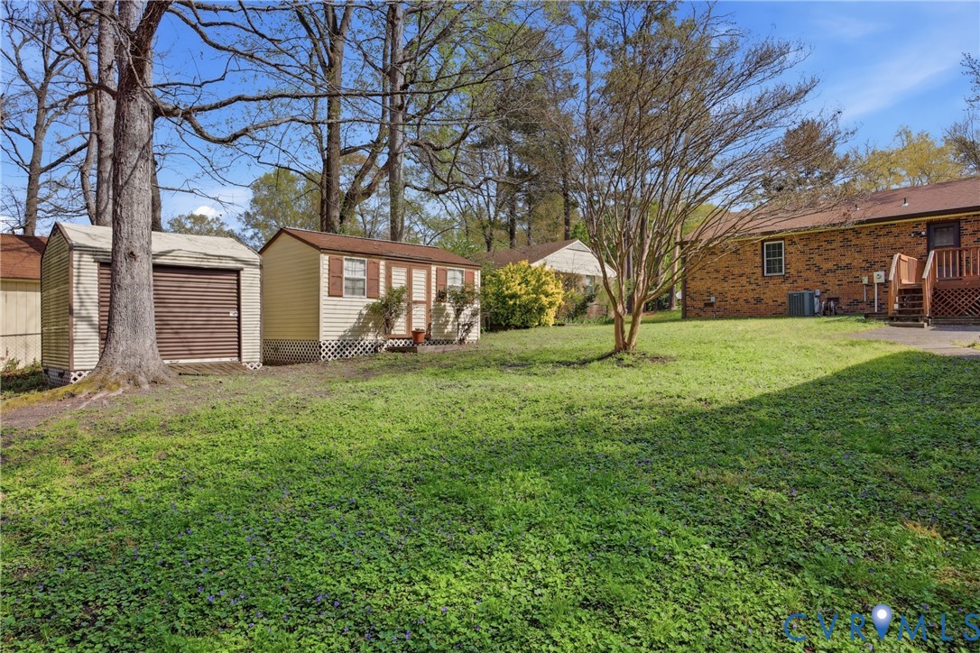9832 Alfaree Road Richmond, VA 23237 - Photo 32 of 35 View of green lawn featuring an outdoor structure