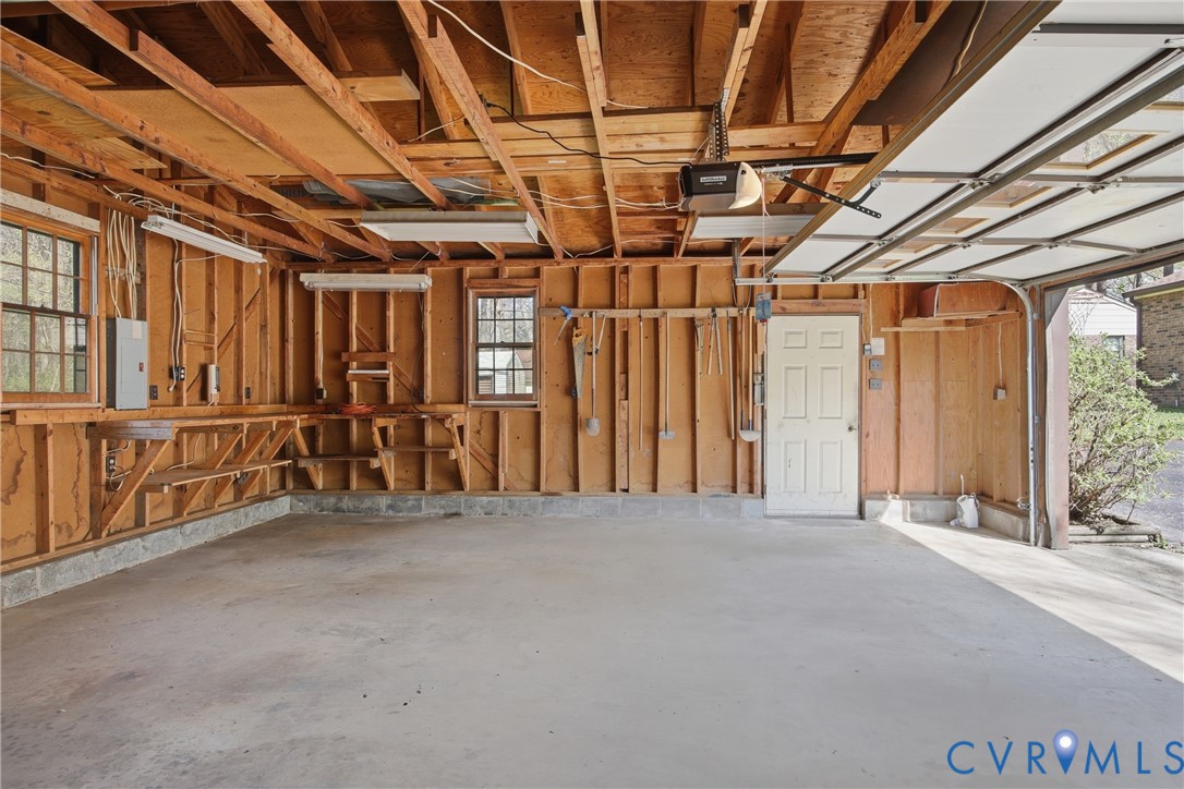 9832 Alfaree Road Richmond, VA 23237 - Photo 34 of 35 Garage featuring a garage door opener