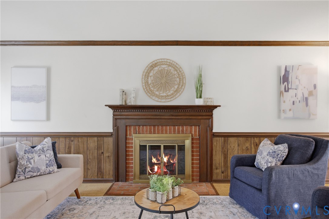 9832 Alfaree Road Richmond, VA 23237 - Photo 8 of 35 Living room with wood walls, wainscoting, and a fi