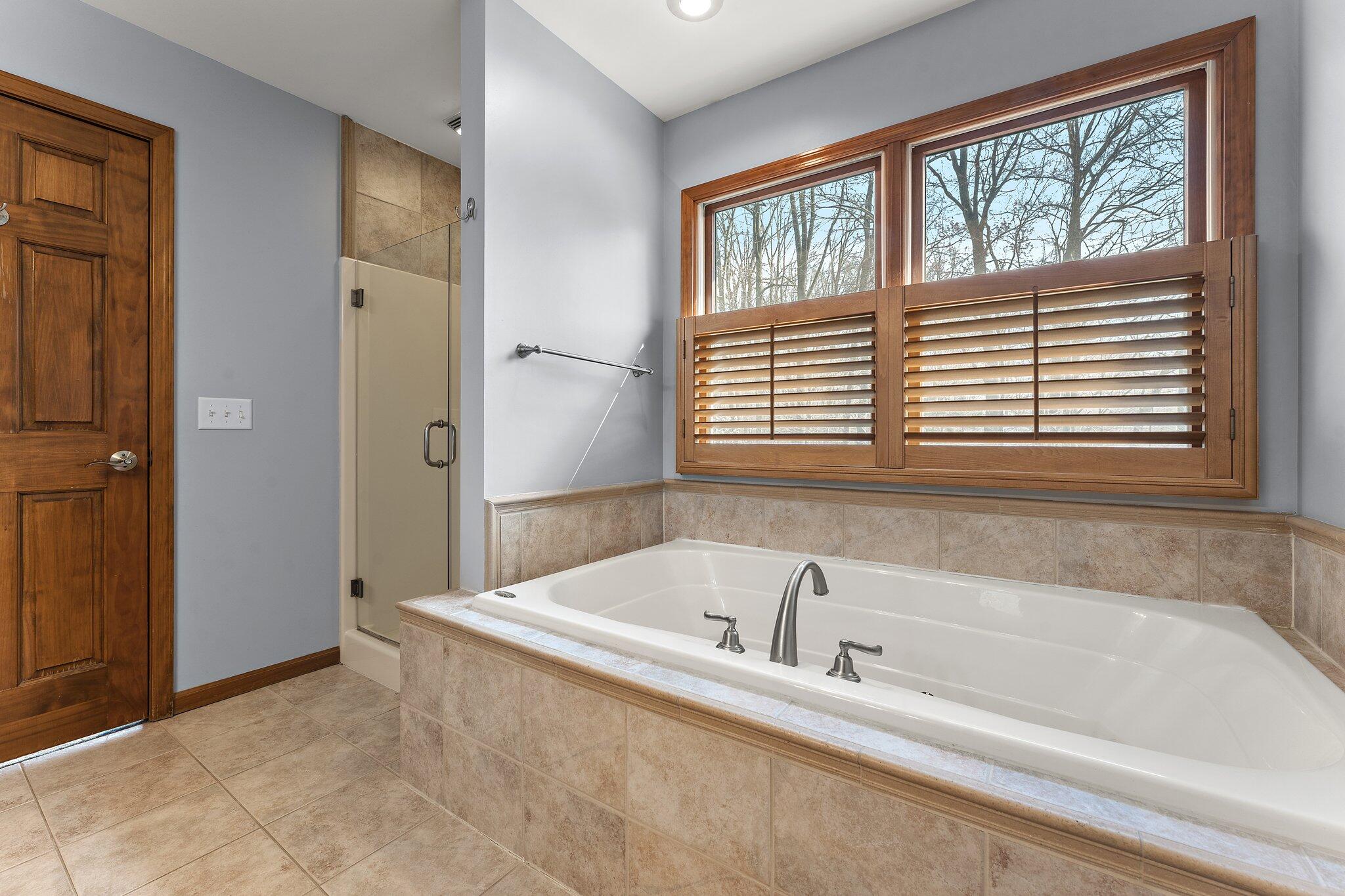 437 Lost Tree Drive Chesterton, IN 46304 - Photo 22 of 43 a bathroom with a bathtub and a shower