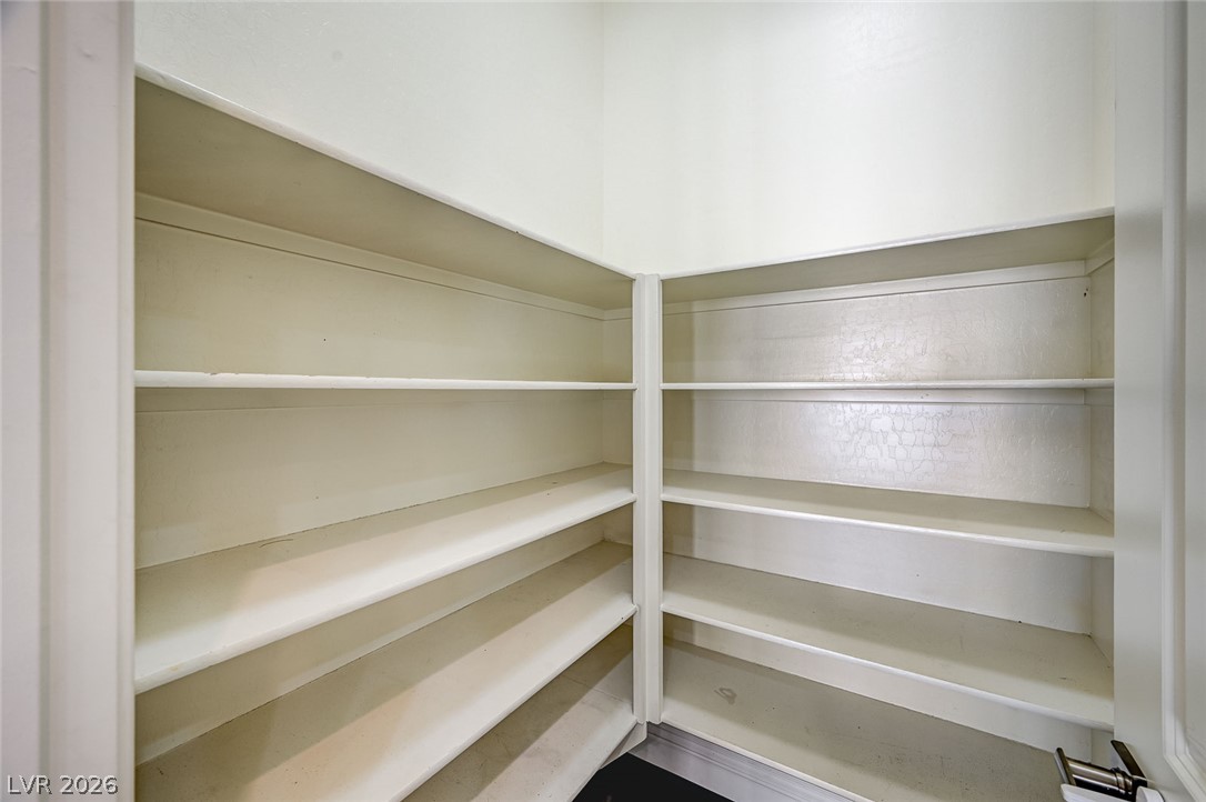 8197 Riley Love Street Las Vegas, NV 89139 - Photo 16 of 48 Ample built-in shelving provides generous storage in this functional pantry.