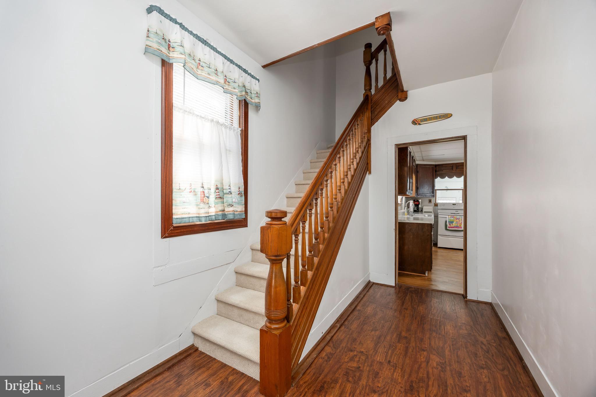 20541 Nanticoke Road Nanticoke, MD 21840 - Photo 5 of 36 a view of entryway and hall with wooden floor