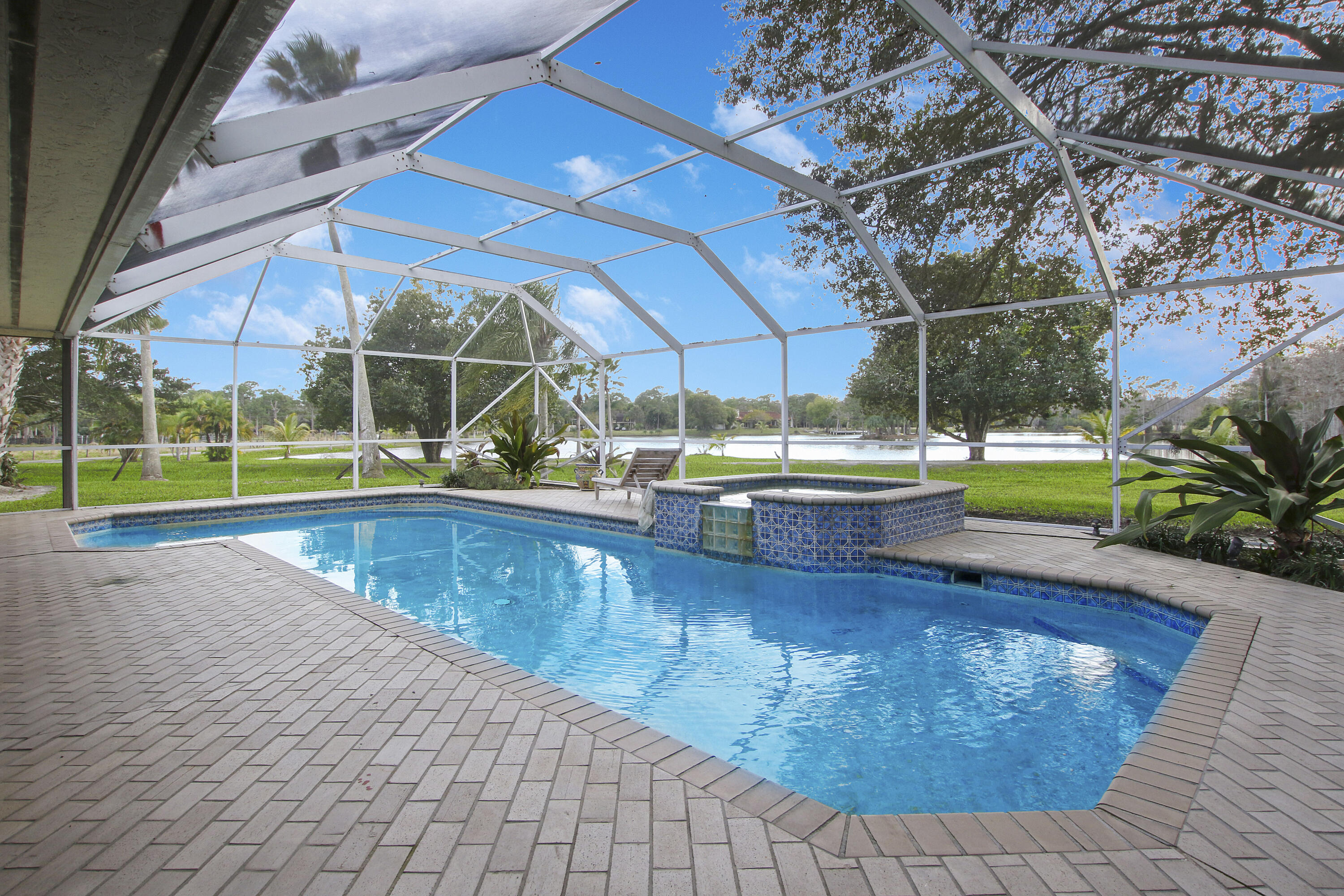 19900-addl Southeast Mack Dairy Road Jupiter, FL 33478 - Photo 45 of 50 Pool w lake and land view