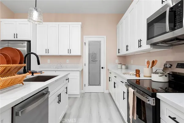 a bedroom with a bed and a ceiling fan