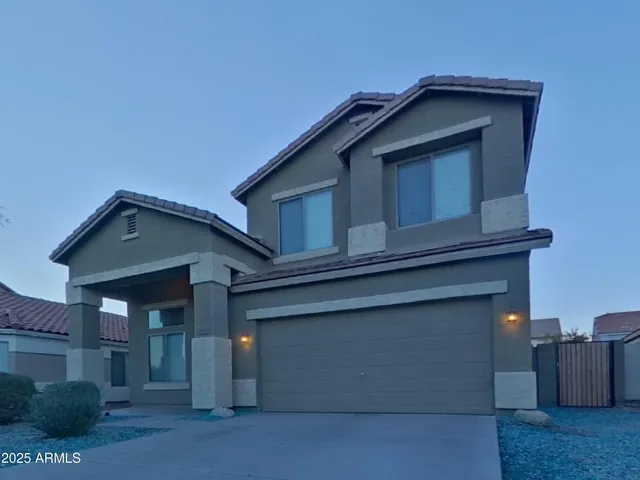 a view of the house with large windows
